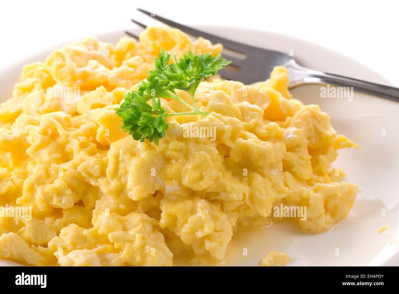 Scrambled eggs on a plate. Stock Photo