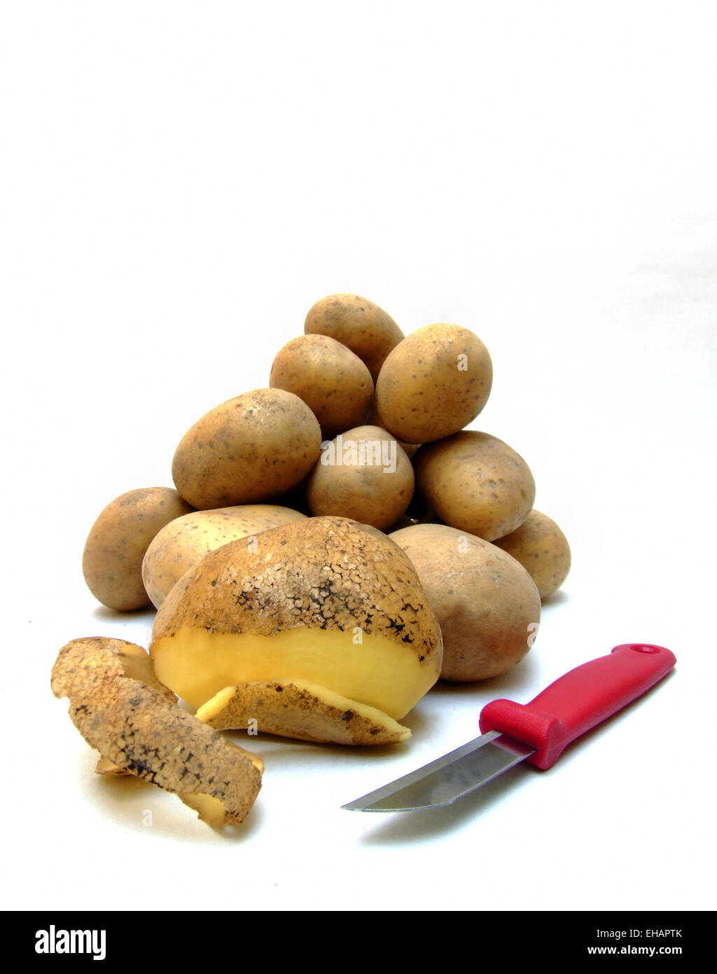 Kartoffeln schälen / to shell potatoes Stock Photo