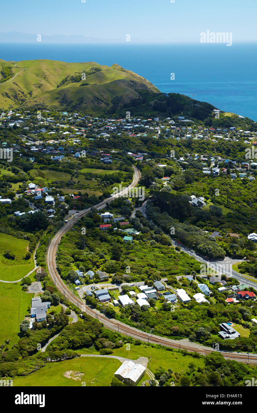 North Island Main Trunk Railway Line at Pukerua Bay, Wellington region, North Island, New Zealand - aerial Stock Photo