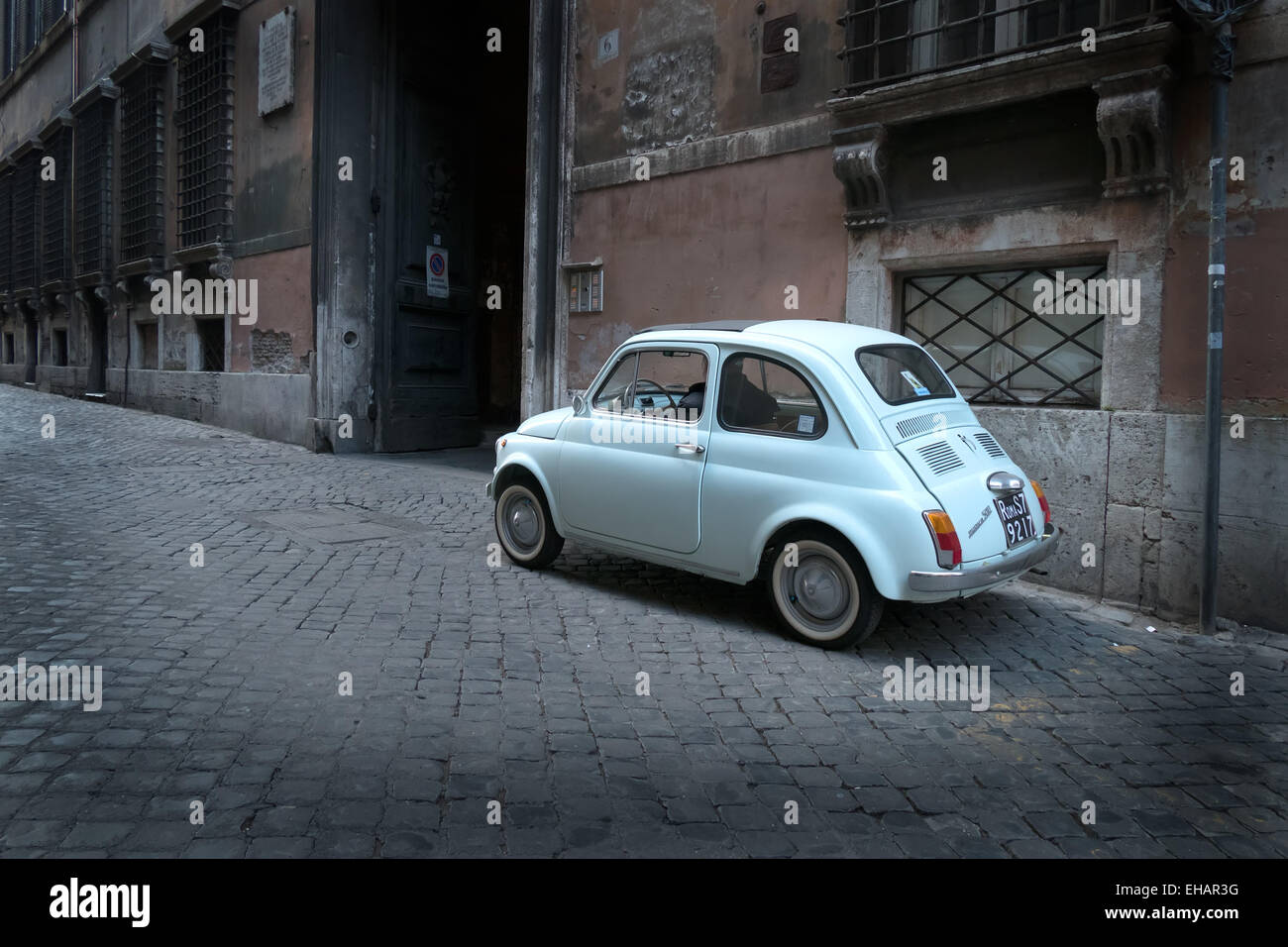 Old car, vintage Fiat Cinquecento parked in the street. Rome, Roma, Italy, Italia, Italian city Stock Photo