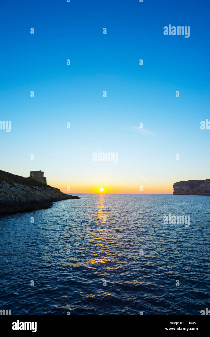 Mediterranean Europe, Malta, Gozo Island, resort town of Xlendi,  Torri ta'Xlendi 17th century watchtower at sunset Stock Photo