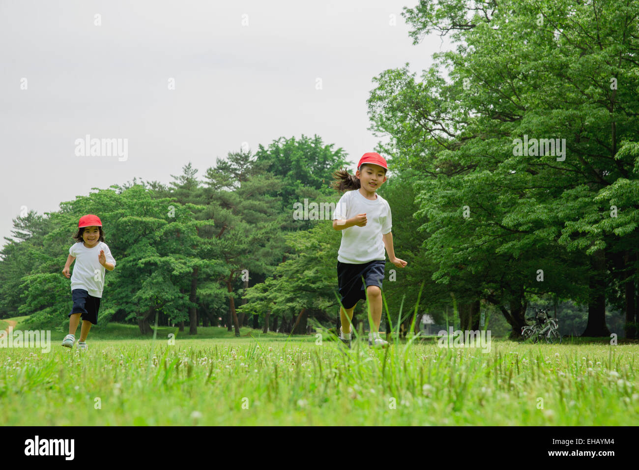 Japanese kids playing in a park Stock Photo. 