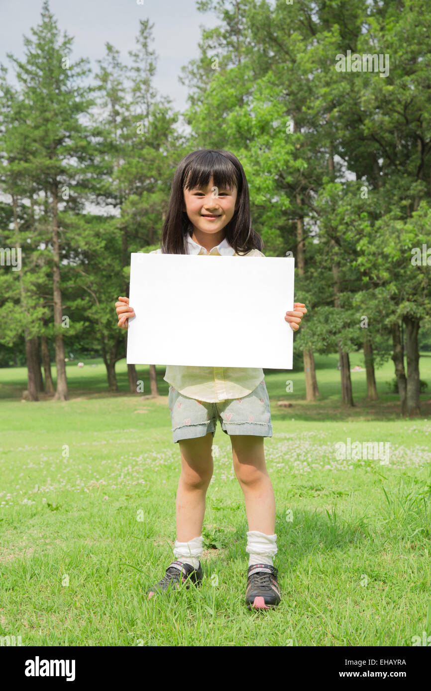 Japanese kid with whiteboard in a park Stock Photo Alamy