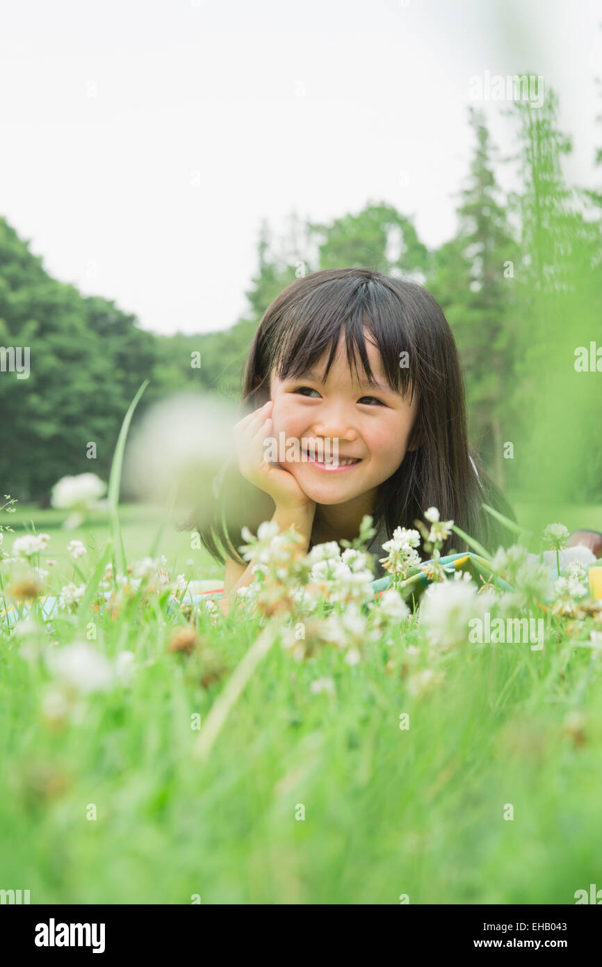 Group children laying on grass hi-res stock photography and images - Alamy
