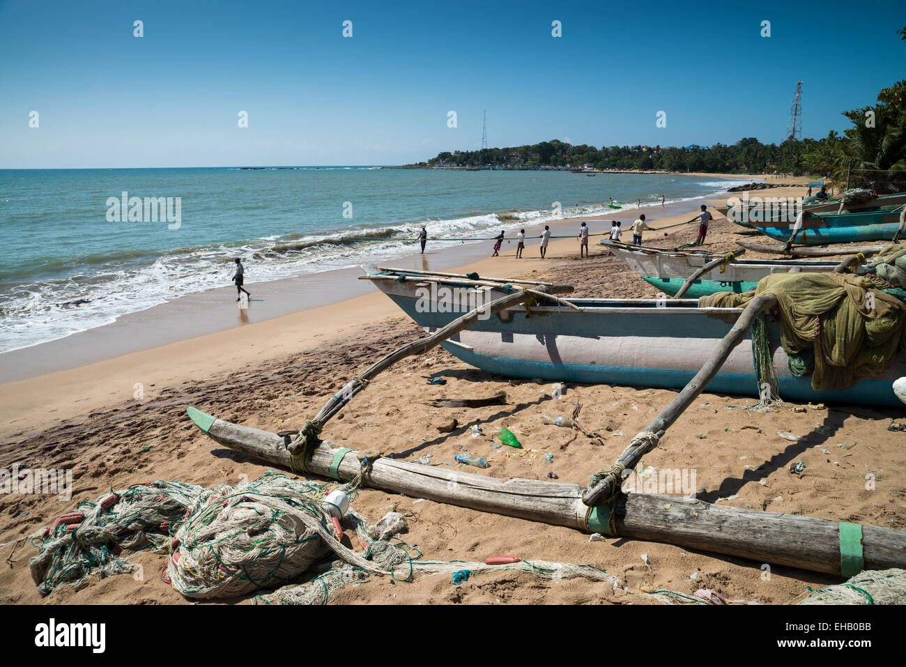 Fishermen pull in their nets on a beach, Tangalle, Sri Lanka, Asia Stock Photo