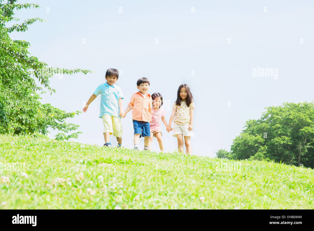 Japanese kids playing in a park Stock Photo. 