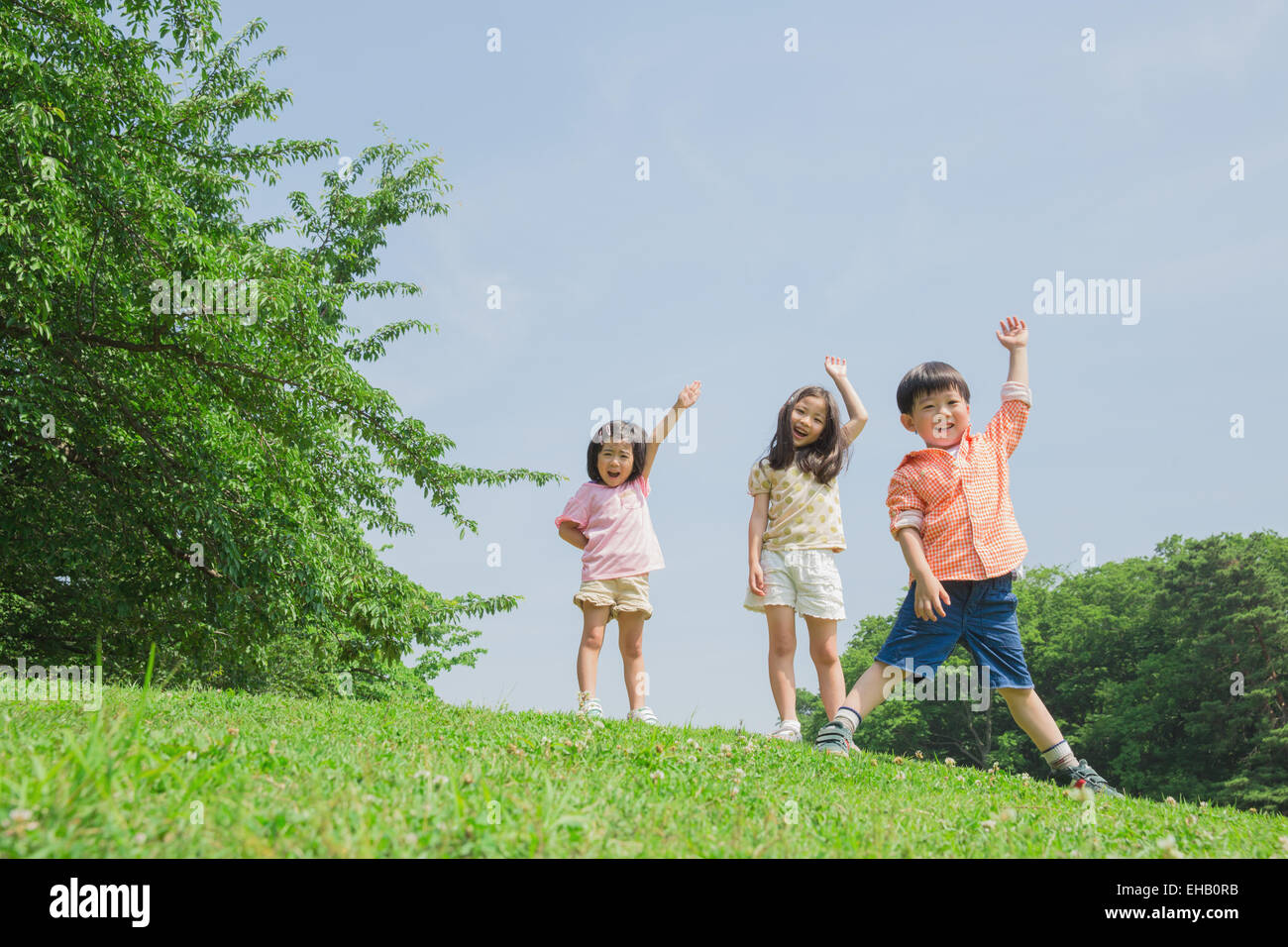 Japanese kids playing in a park Stock Photo. 
