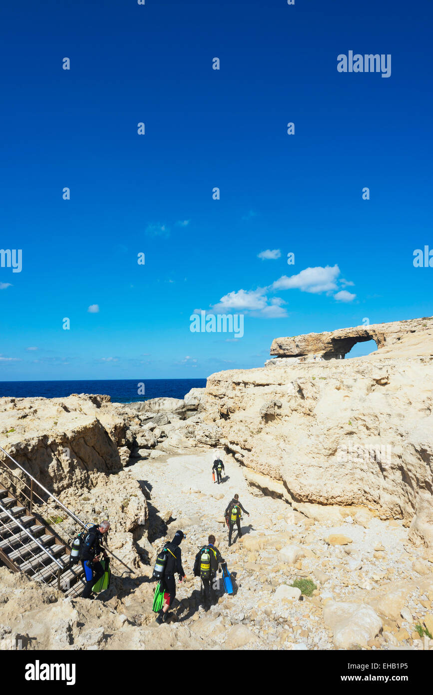 Mediterranean Europe, Malta, Gozo Island, Dwerja Bay, The Azure Window natural arch, scuba divers at the Blue Hole Stock Photo