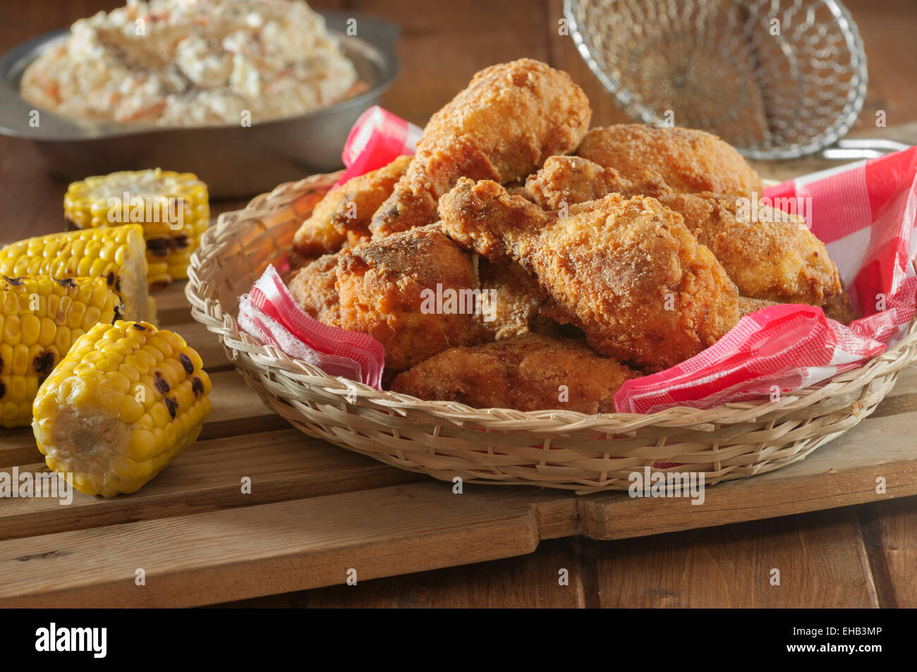 Southern fried chicken with coleslaw and grilled corn Stock Photo