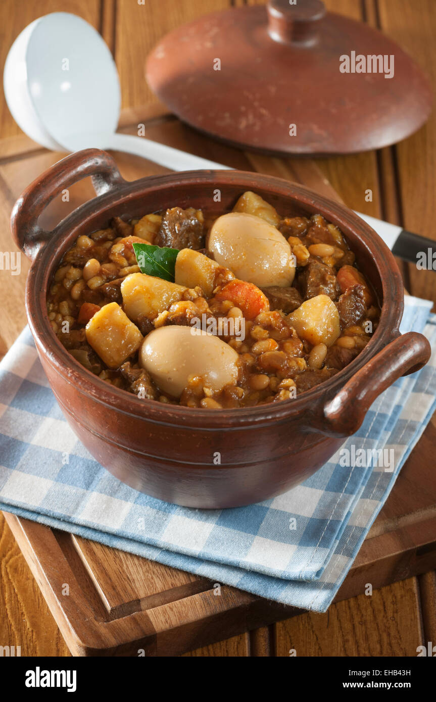 Cholent. Potato, meat, bean and barley stew. Jewish Food Stock Photo