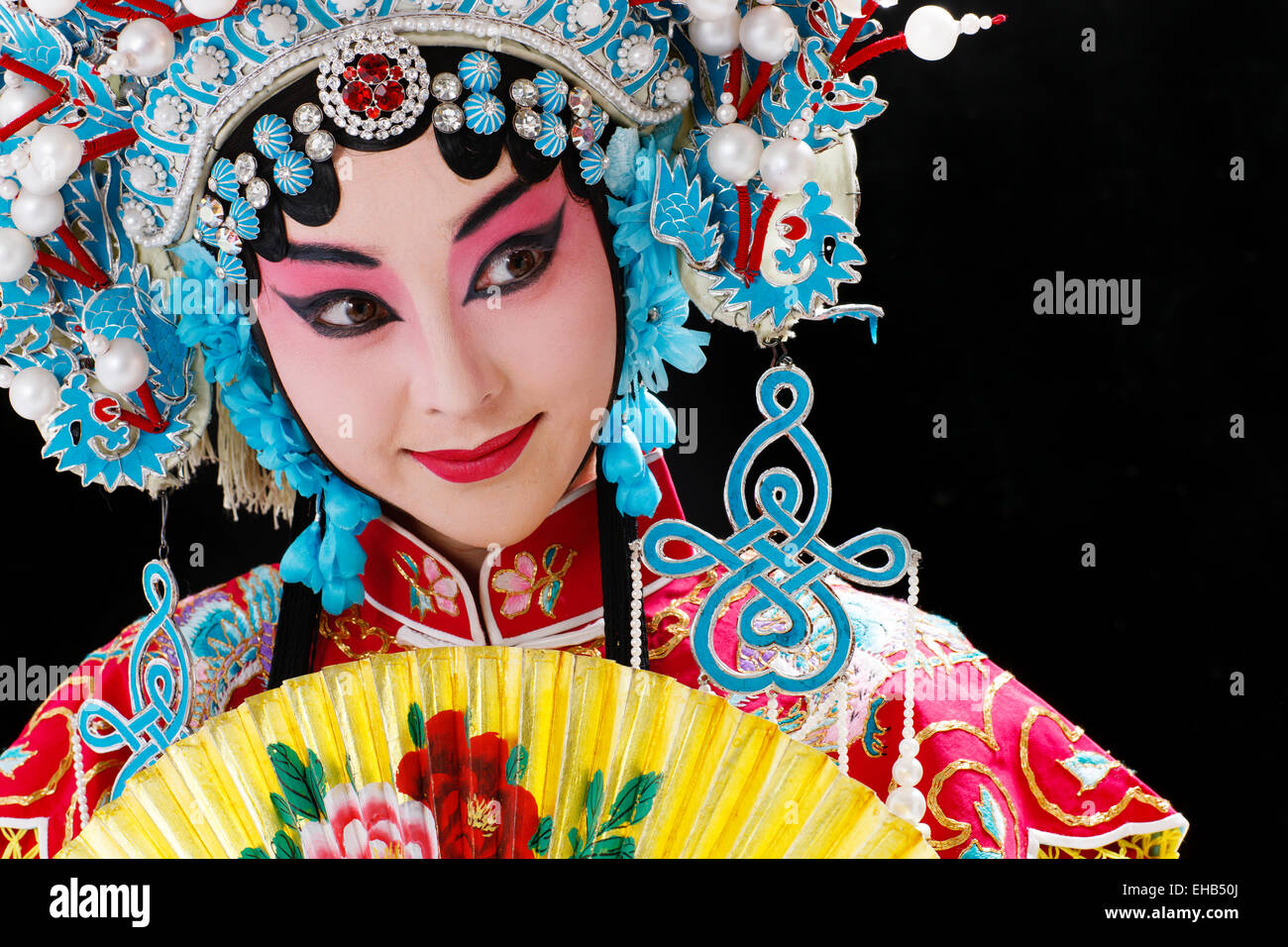 Female Peking Opera performer with a folding fan Stock Photo
