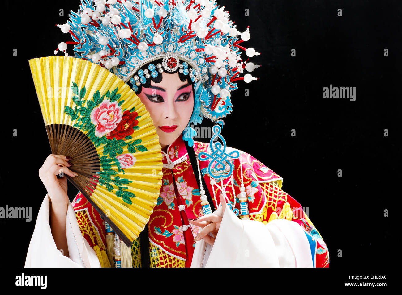 Female Peking Opera performer with a folding fan half block surface Stock Photo