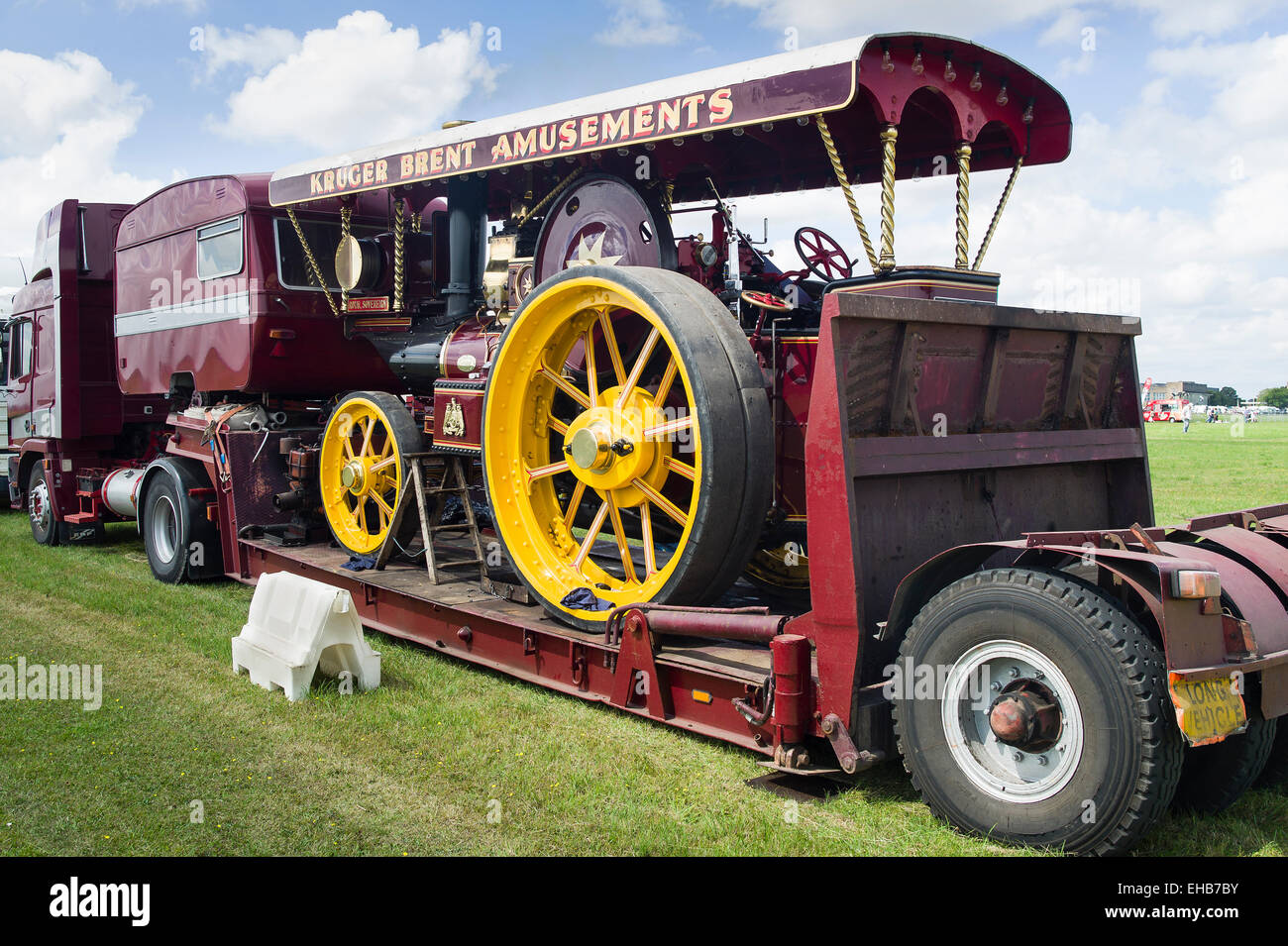 Old steam traction engine on lowloader arriving at an English show