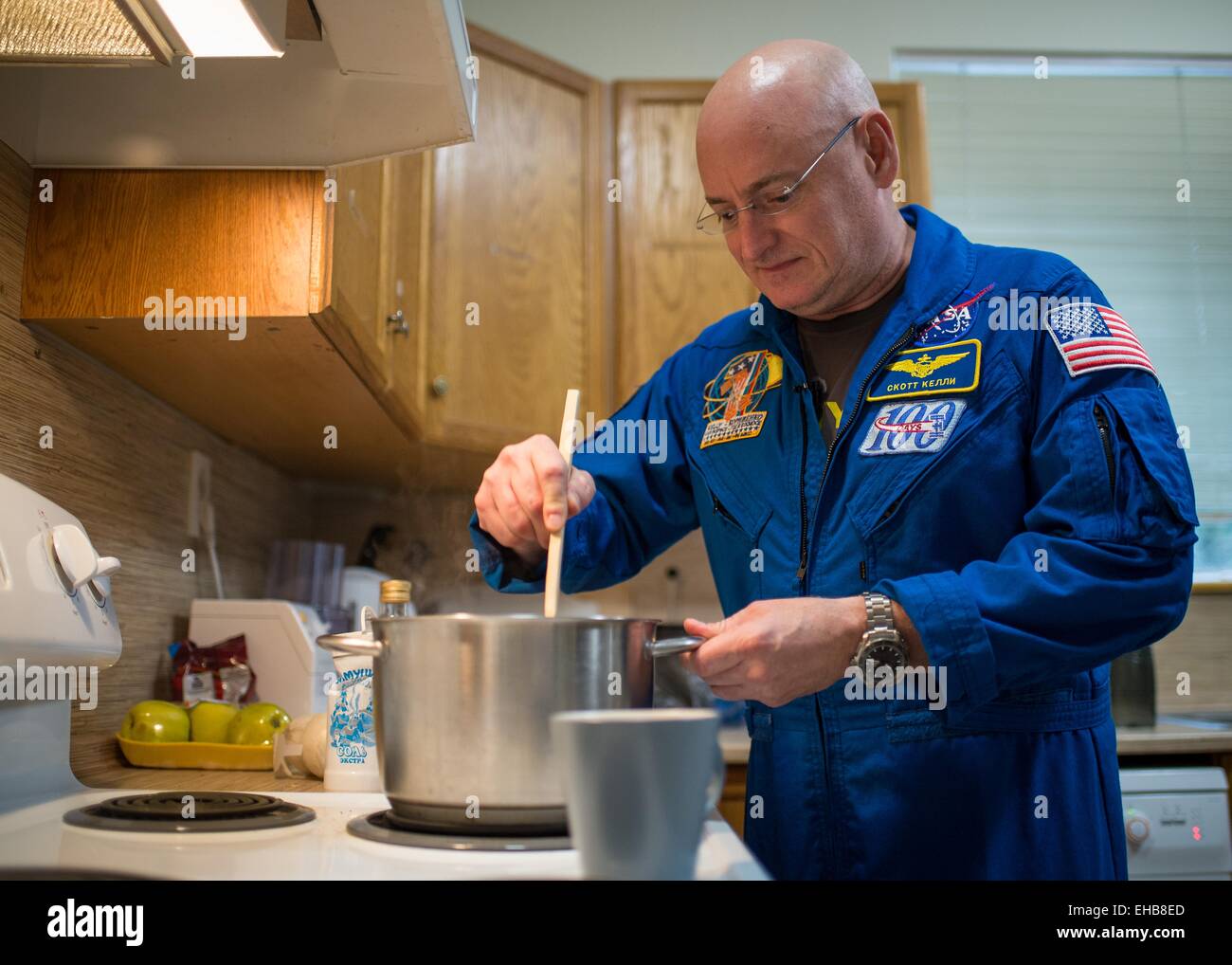 International Space Station Expedition 43 NASA Astronaut Scott Kelly takes a break from his training to make a pot of spaghetti sauce for the evenings meal with friends and family at the Gagarin Cosmonaut Training Center March 8, 2015 in Star City, Russia. Stock Photo