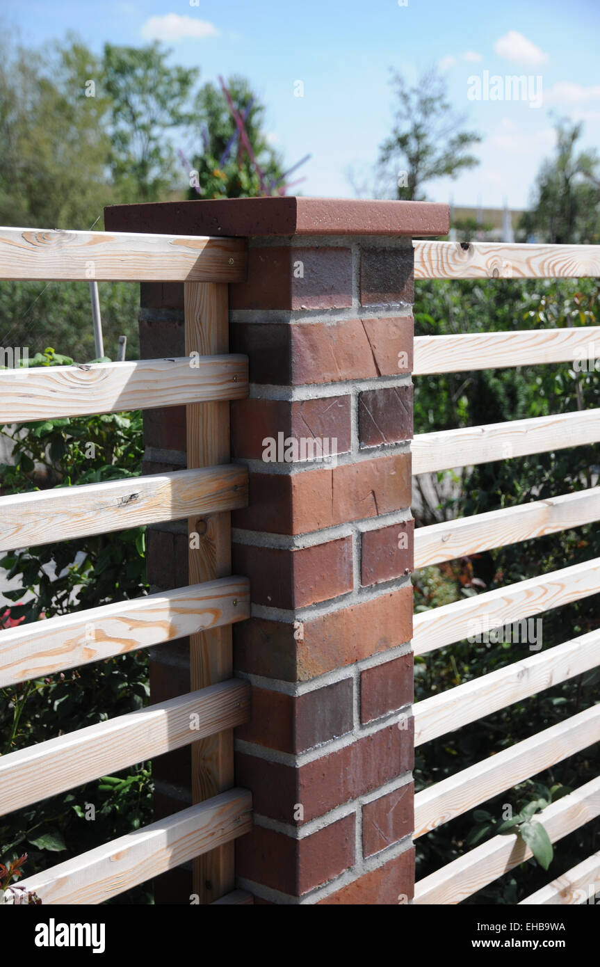 Fence made of bricks Stock Photo