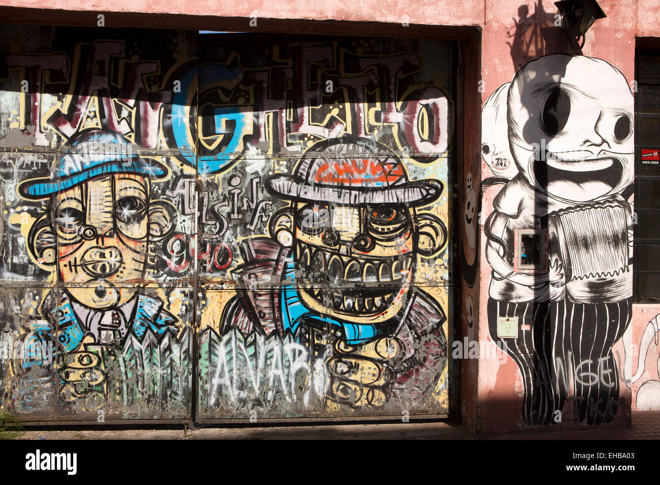 Argentina, Buenos Aires, San Telmo, Defensa, graffiti on gates to house yard Stock Photo