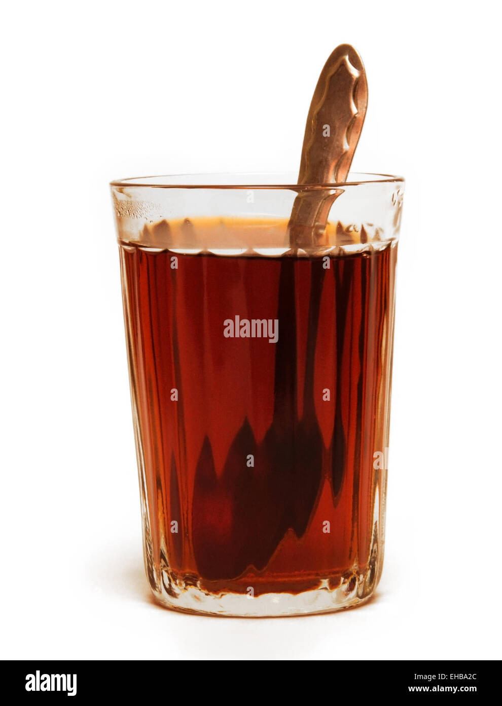 Glass of tea with spoon Stock Photo Alamy