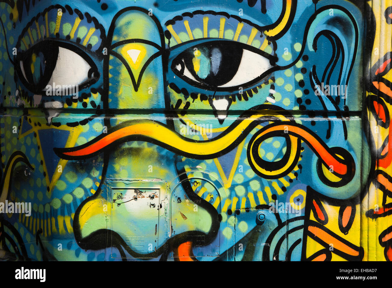 Argentina, Buenos Aires, San Telmo, Defensa, face graffiti on house wall Stock Photo