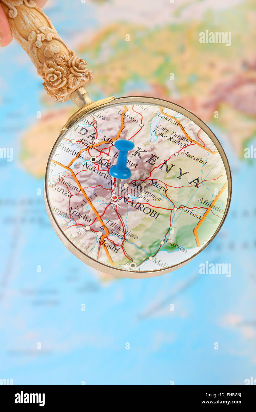 Blue tack on map of Africa with magnifying glass looking in on Nairobi
