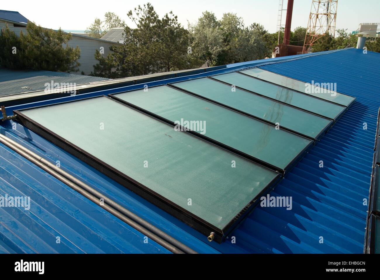 Solar water heating system on the house roof Stock Photo - Alamy