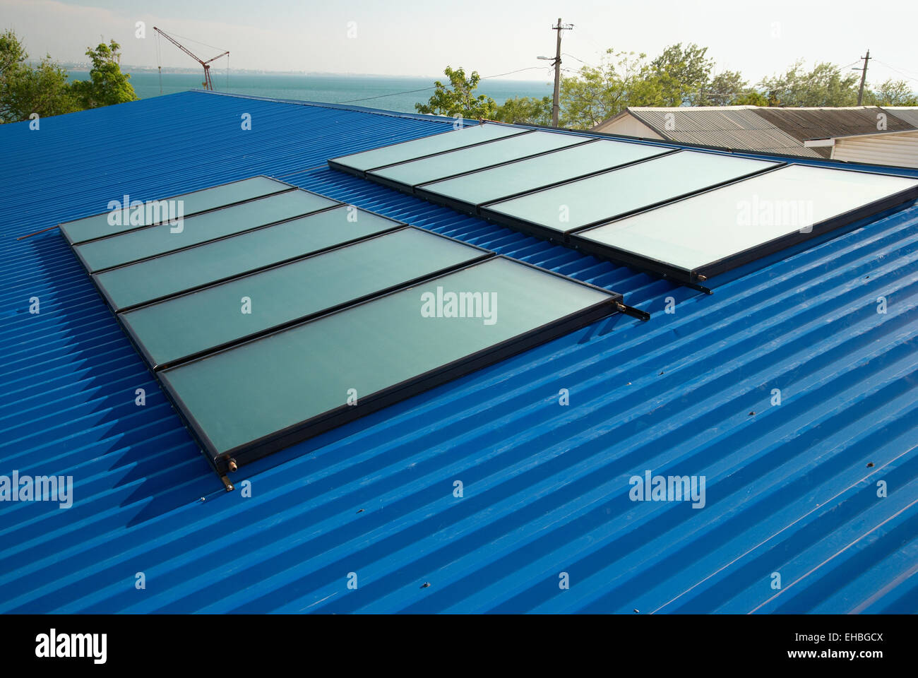 Solar water heating system on the house roof Stock Photo - Alamy