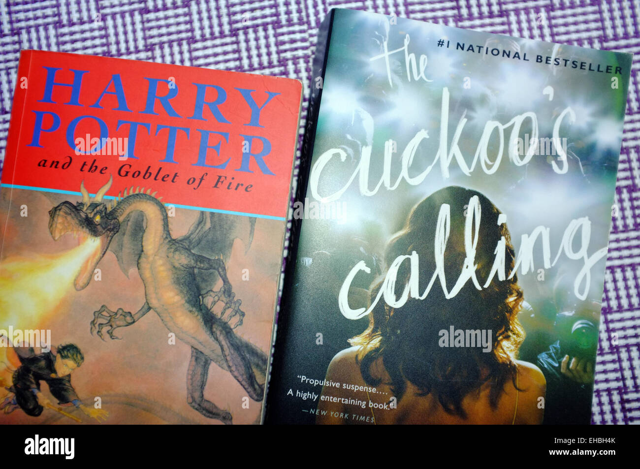 The Cuckoo's Calling and a book from the Harry Potter series, both books by the author JK Rowling. Stock Photo