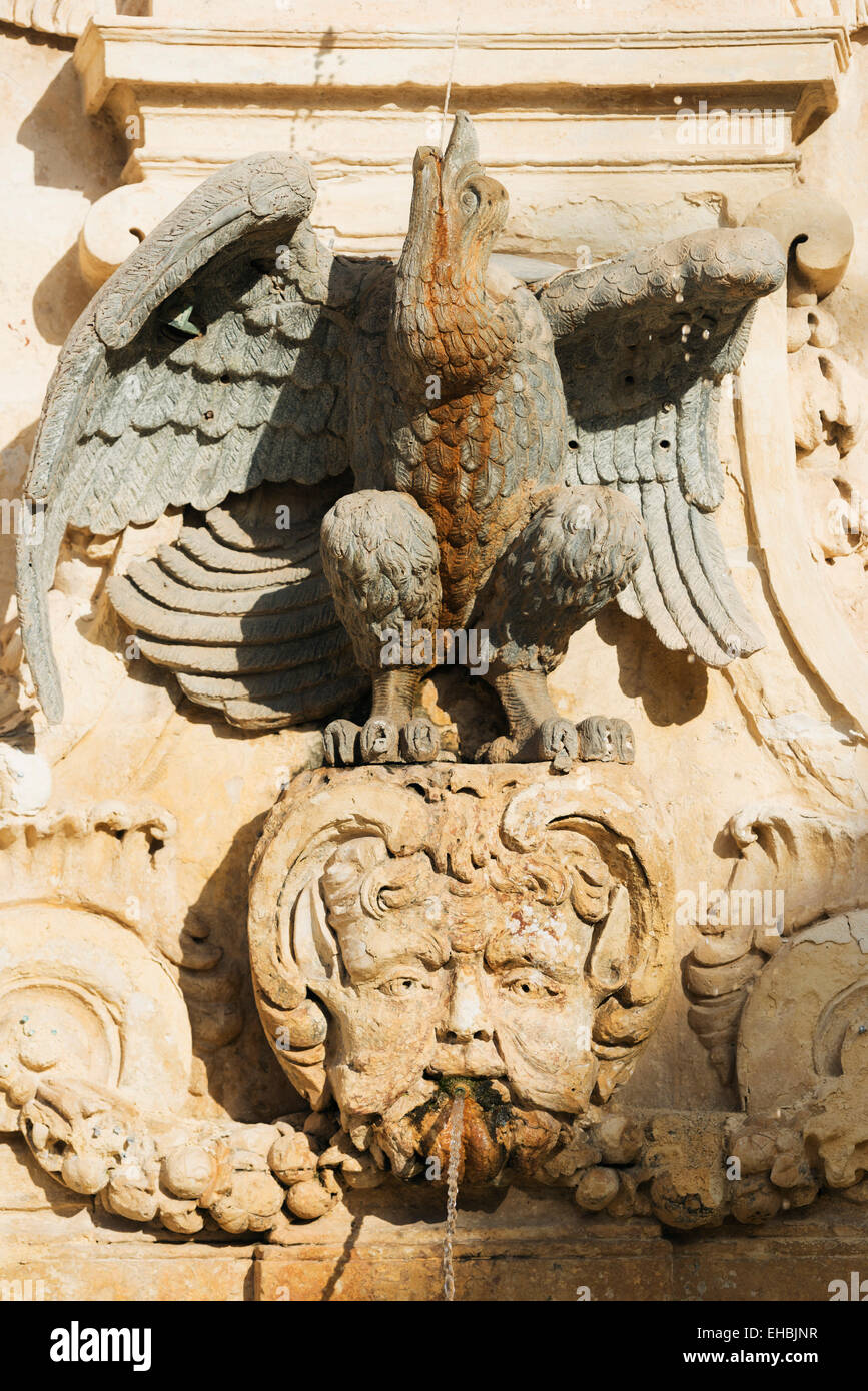 Mediterranean Europe, Malta, Valletta, carved face on a fountain in St. George's Square Stock Photo
