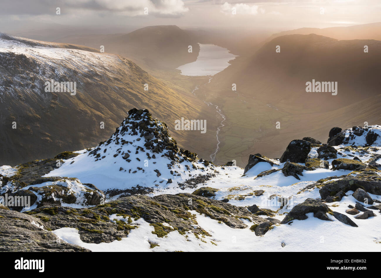 Westmorland Cairn and Wastwater in dramatic evening sunlight, Great Gable, English Lake District Stock Photo