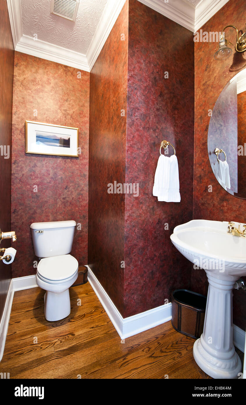 Modern residential wallpapered powder room  in a single family house Stock Photo