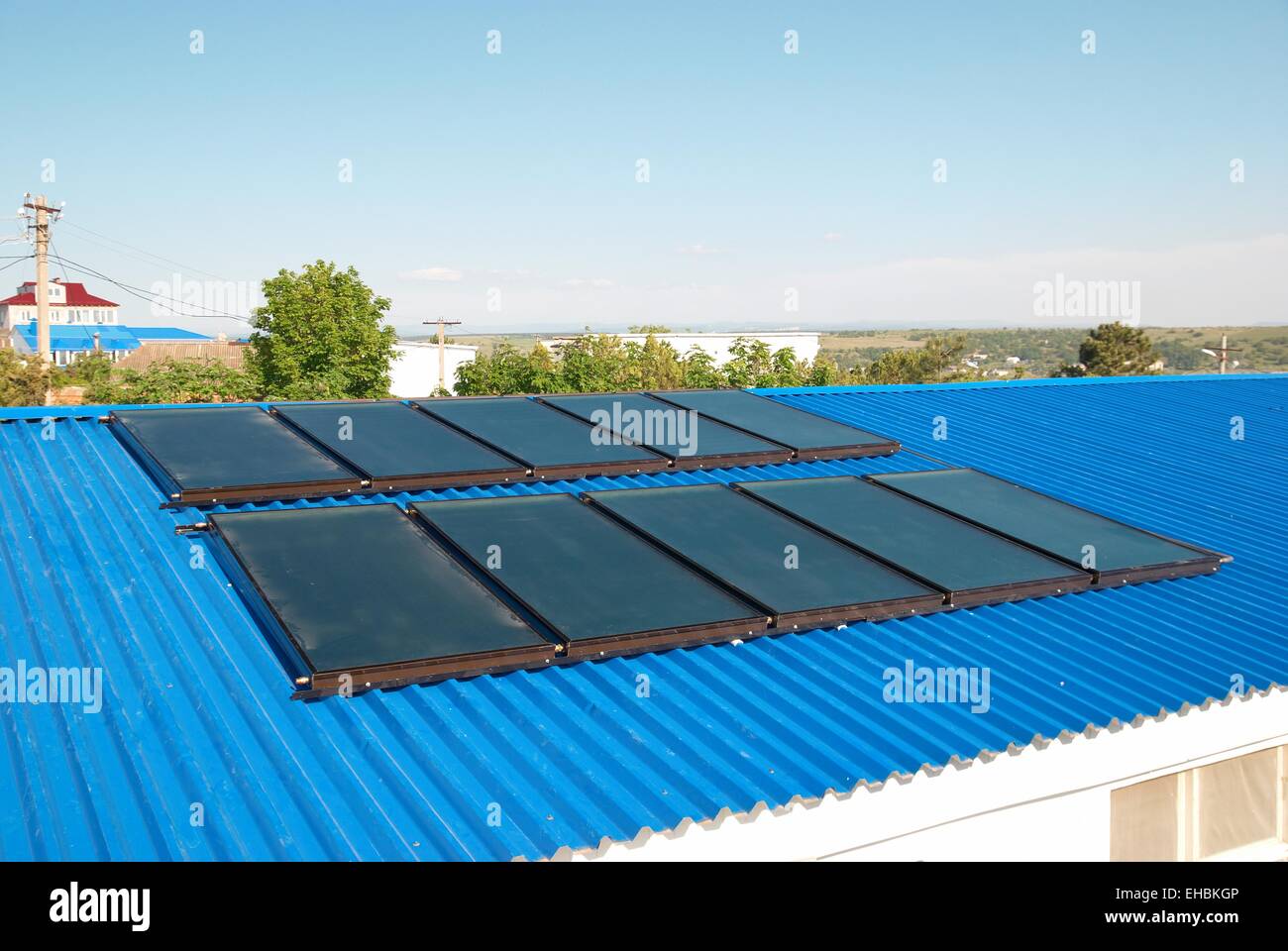 Solar water heating system on the house roof Stock Photo - Alamy