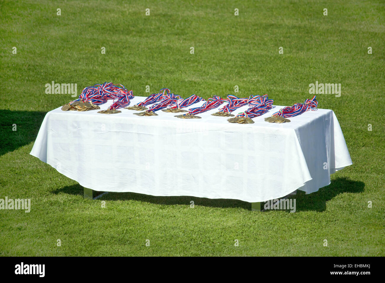 Sport medals on footbal field Stock Photo