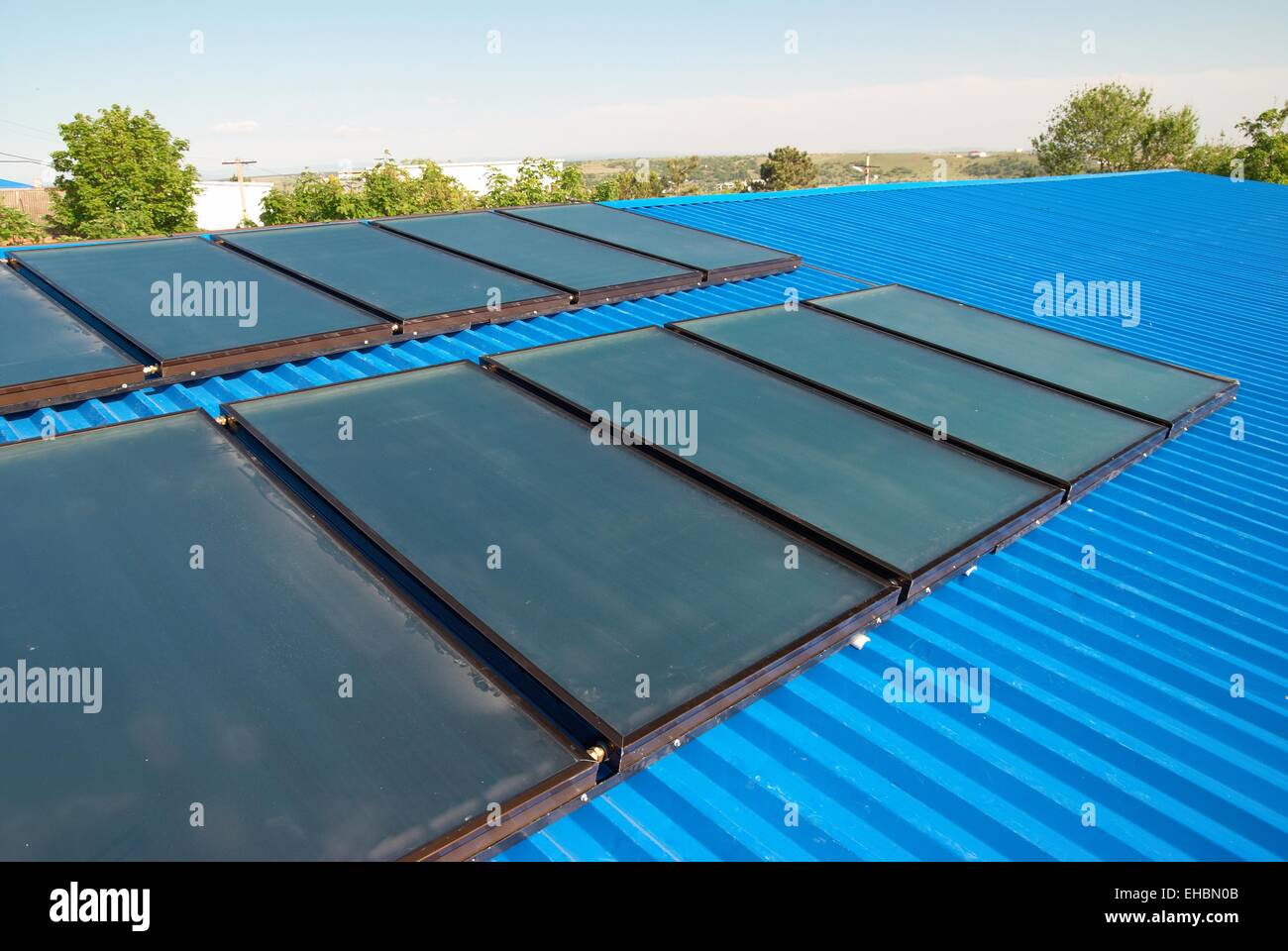 Solar water heating system on the house roof Stock Photo - Alamy