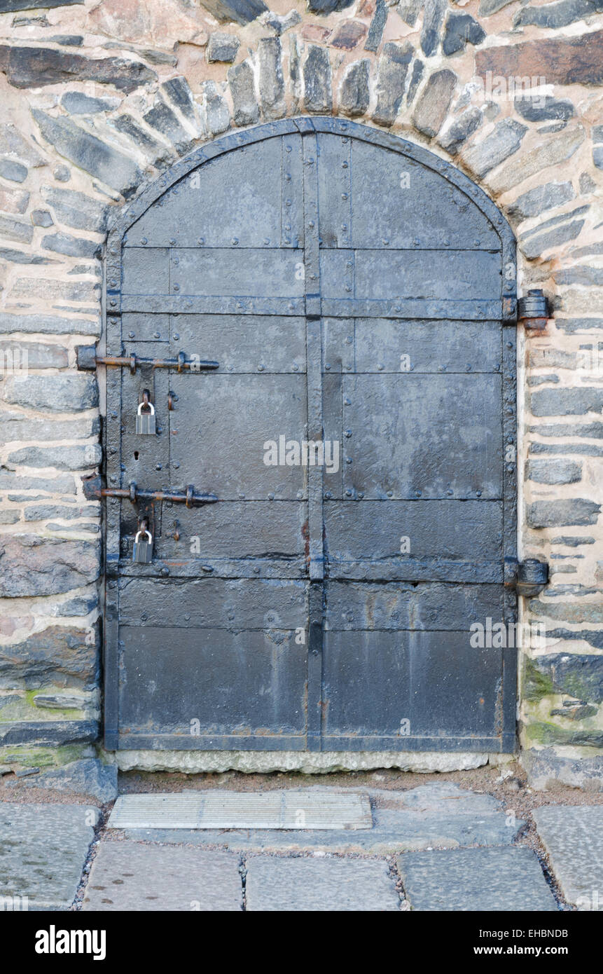 one old door on the castle the door is lock Stock Photo