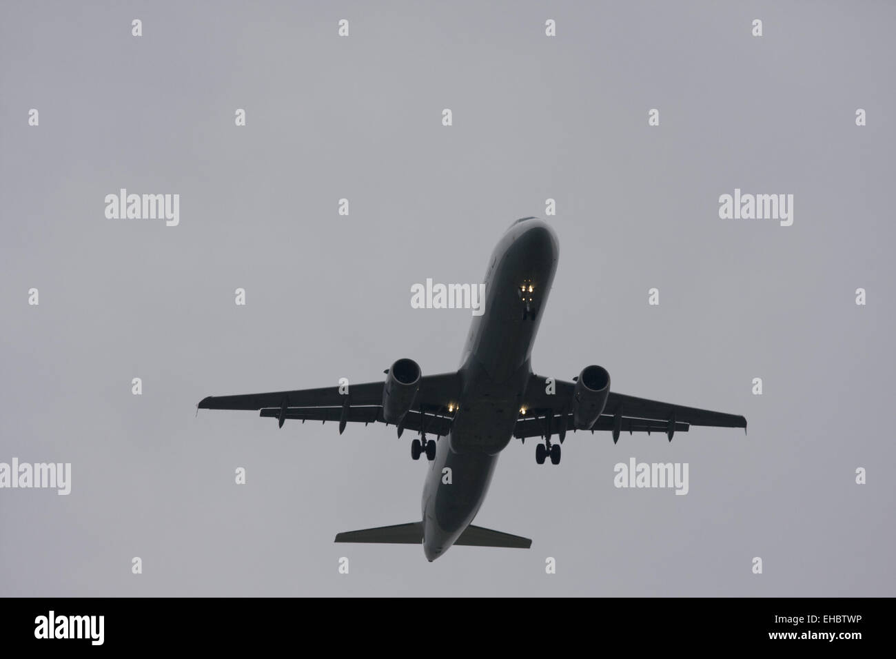 plane landing on a grey day Stock Photo