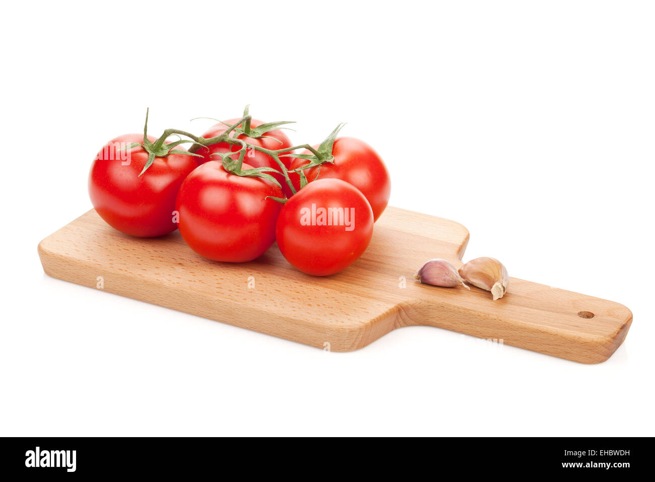 Ripe tomatoes on cutting board. Isolated on white background Stock ...