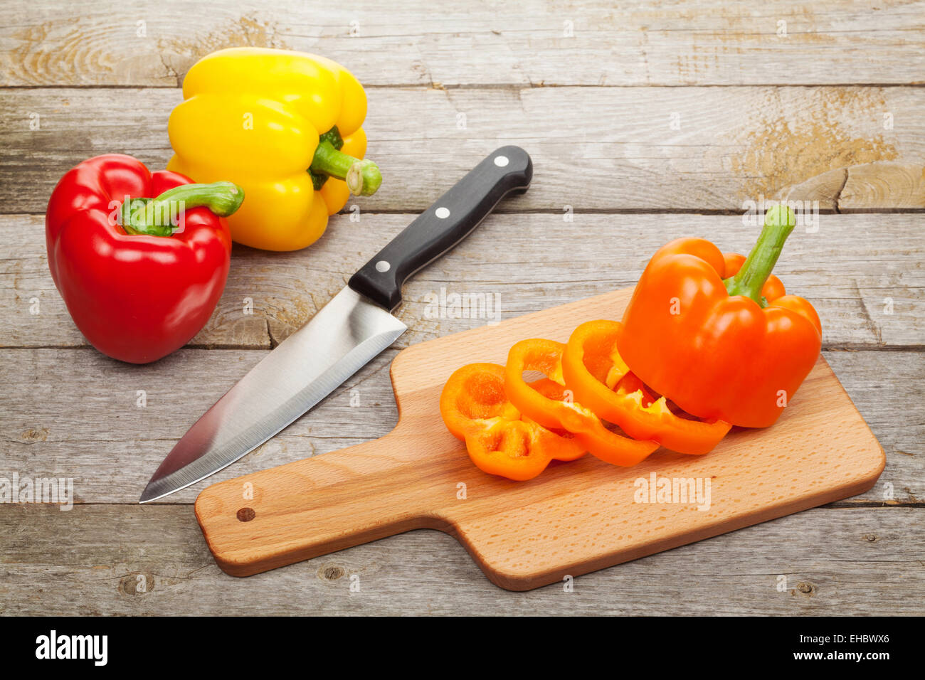 Sliced bell pepper on cutting board over wooden table Stock Photo - Alamy