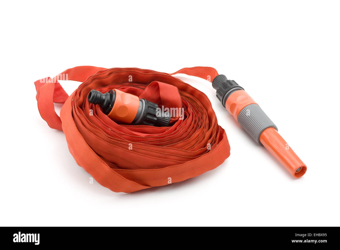 coiled red garden hose with nozzle Stock Photo Alamy