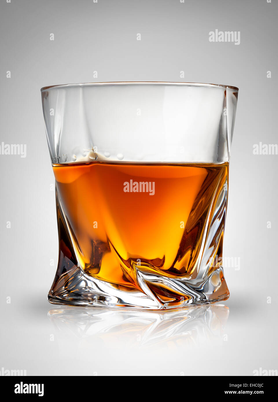 Glass of cognac on a gray background Stock Photo