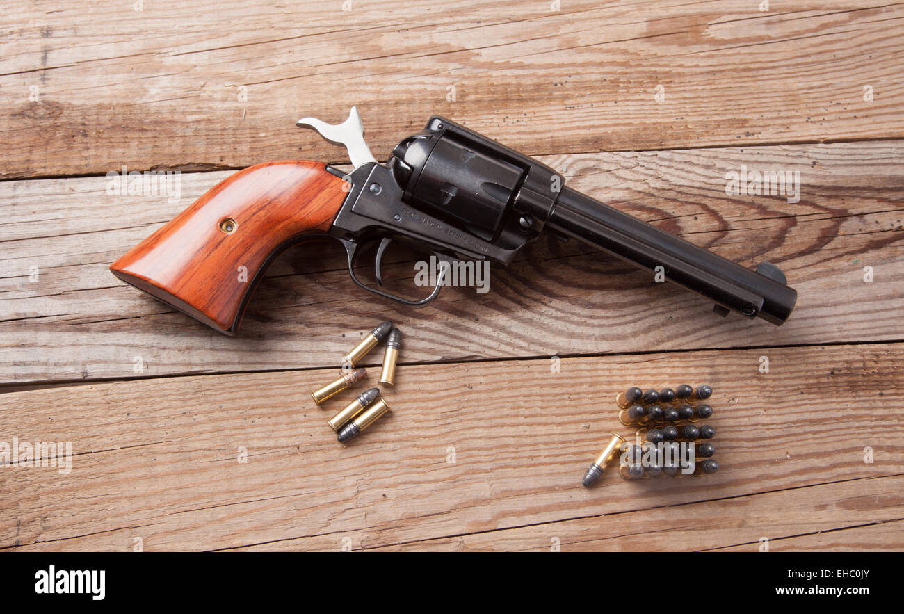A 22 caliber revolver with bullets. Stock Photo