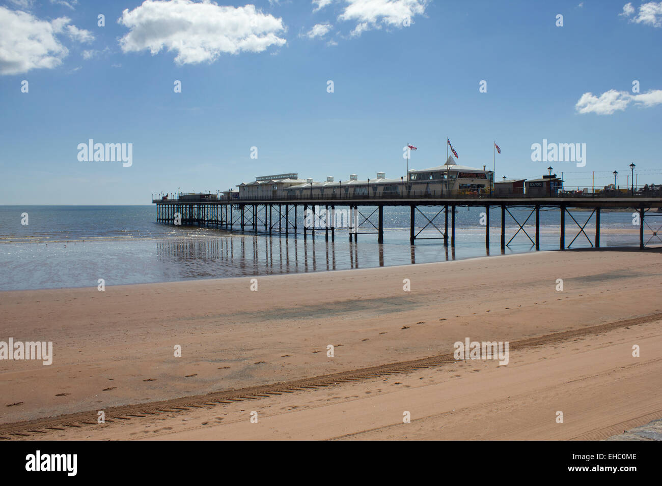 Pier and beach at Paignton, Devon, UK on a summer's day. A typical summer scene at a traditional British holiday resort. Stock Photo