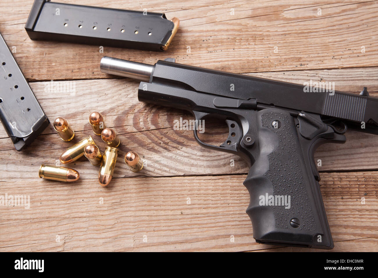 A pistol with two clips and bullets Stock Photo Alamy