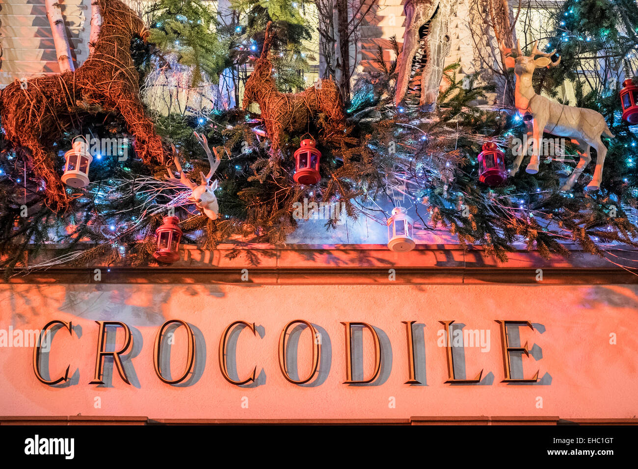 'Au Crocodile' restaurant sign with Christmas decorations Strasbourg Alsace France Europe Stock Photo