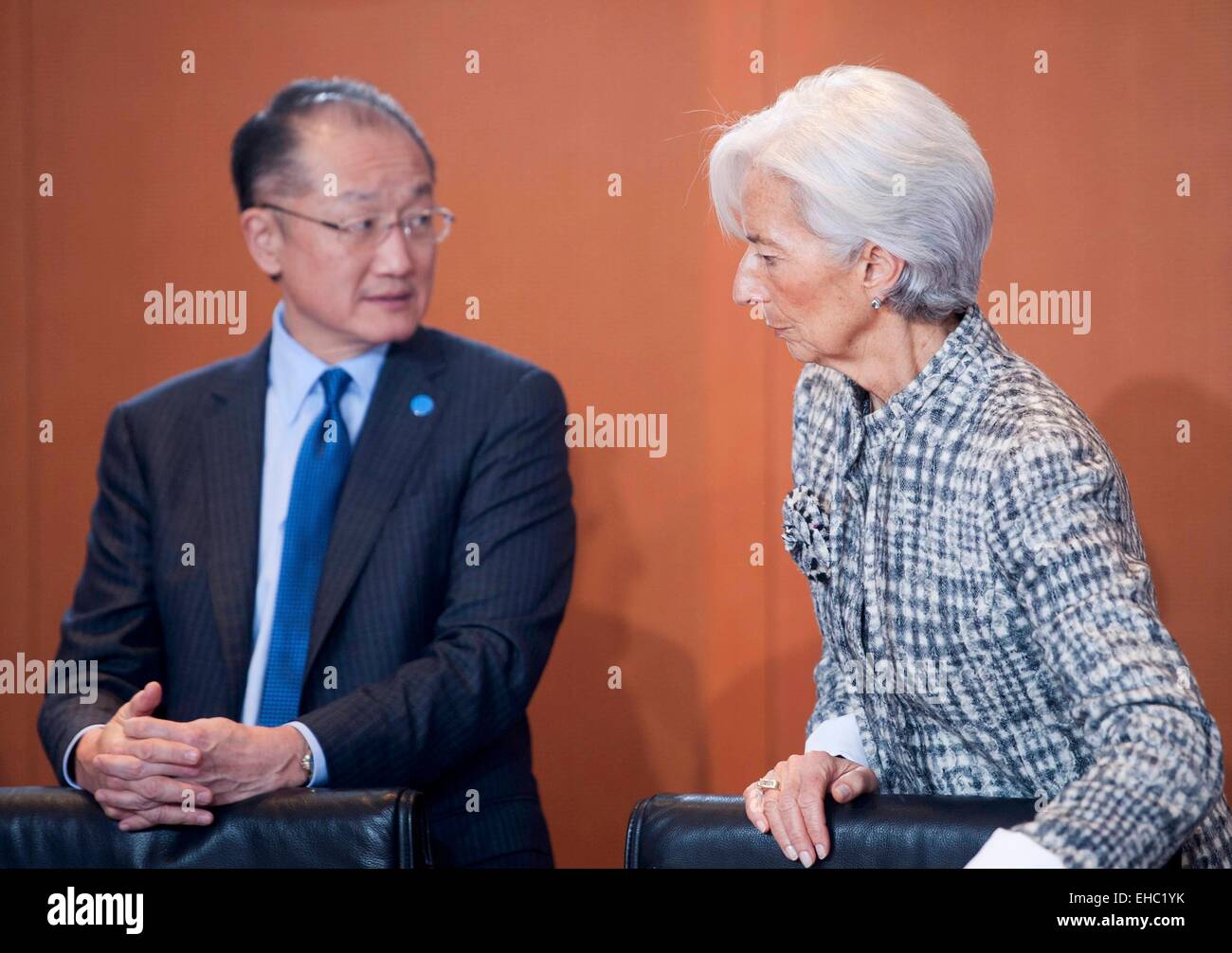 Berlin, Germany. 11th Mar, 2015. The President of The World Bank Jim Yong Kim and Managing Director of the International Monetary Fund (IMF) Christine Lagarde (R) wait for the start of a meeting of leaders of economic and financial institutions with German Chancellor Angela Merkel, at the Chancellery in Berlin March 11, 2015. Credit:  dpa picture alliance/Alamy Live News Stock Photo