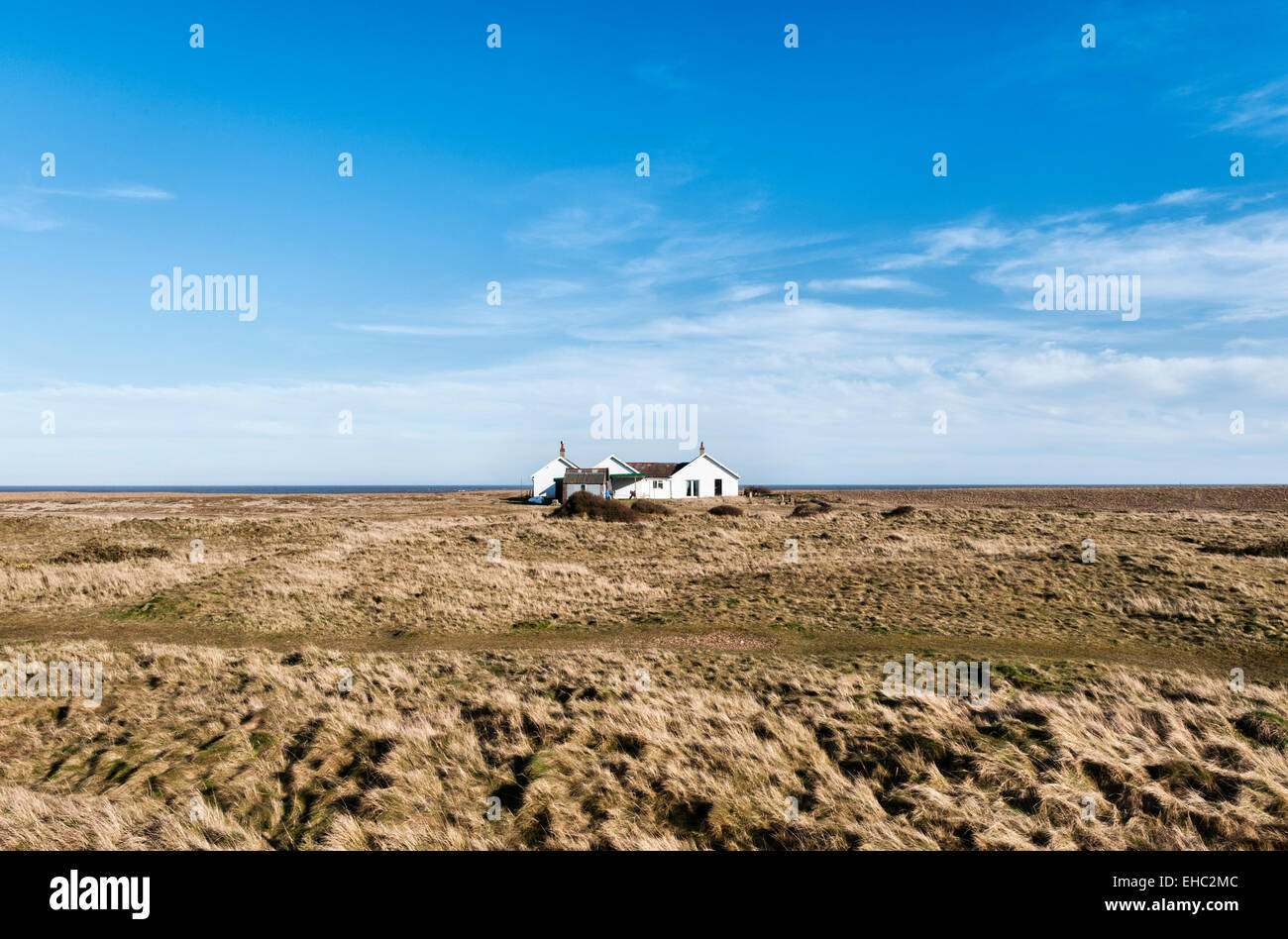 A solitary bungalow in the isolated coastal hamlet of Shingle Street, Suffolk, UK, on Britain's east coast Stock Photo