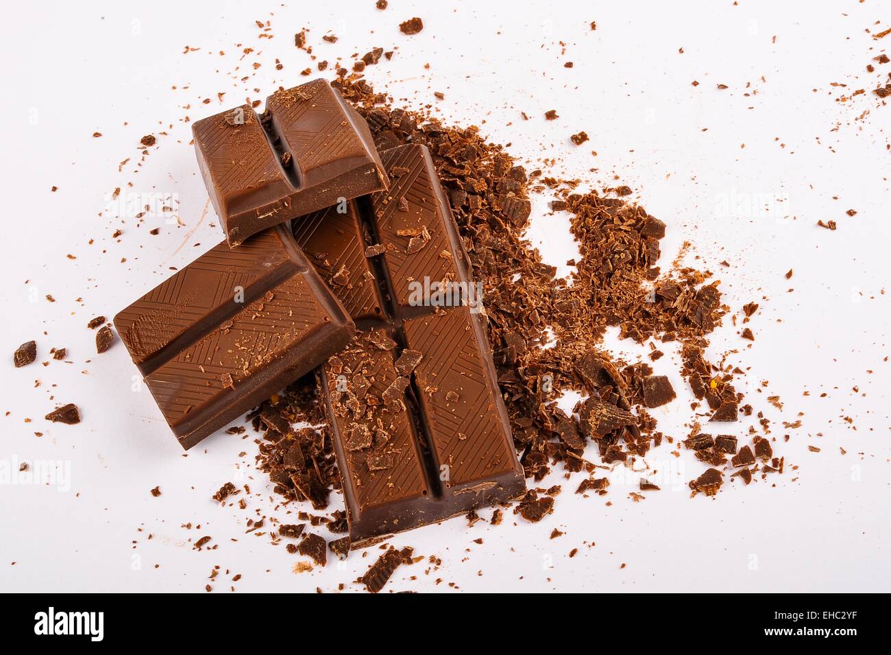 Raw dark chocolate bars on white background Stock Photo