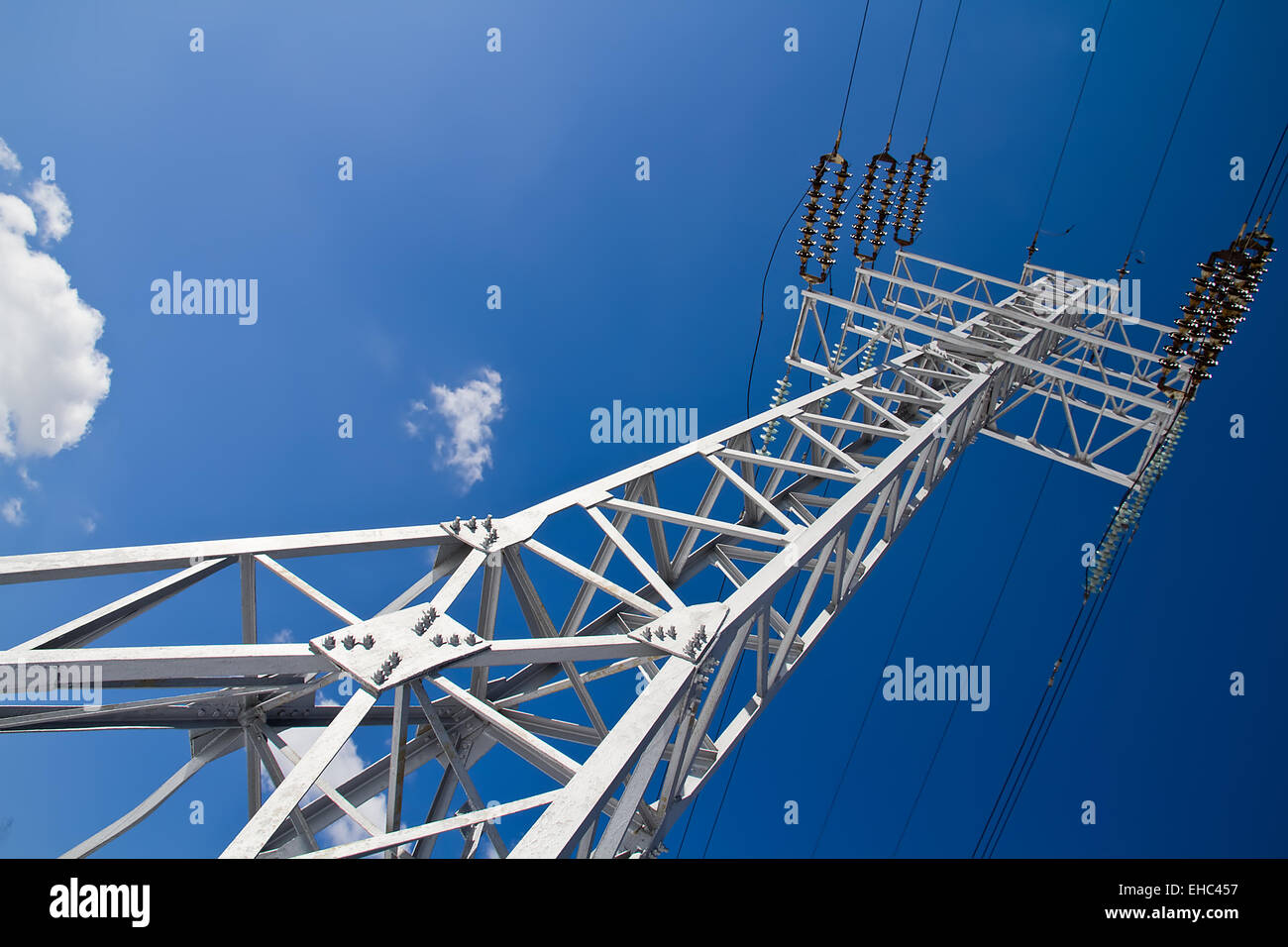 Reliance power lines against the blue sky Stock Photo