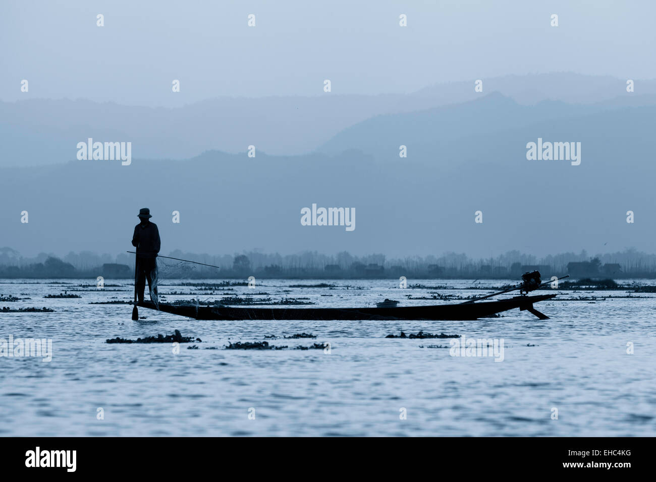 Lone fisherman at sunrise, Inle Lake, Myanmar ( Burma ), Asia Stock Photo
