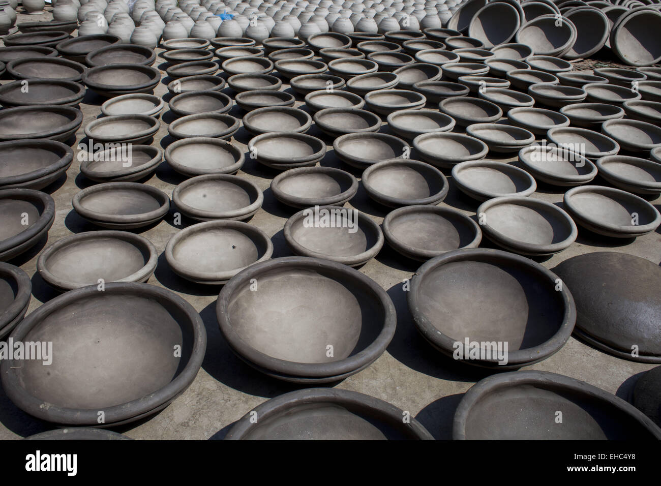 Dhaka, Bangladesh. 11th Mar, 2015.Potter making pots using clay near