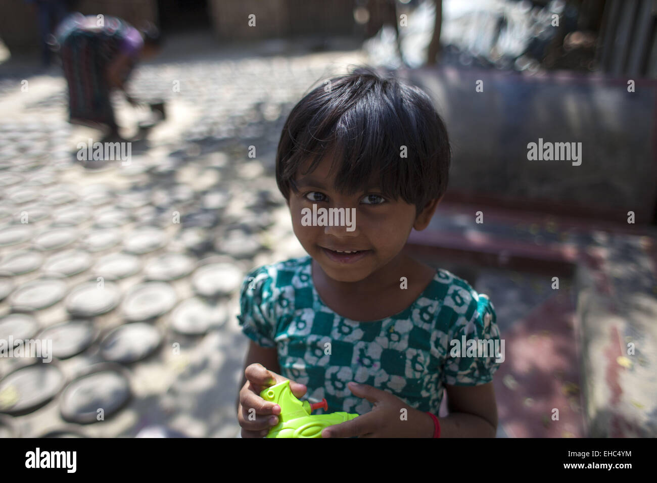 Dhaka, Bangladesh. 11th Mar, 2015.Potter making pots using clay near