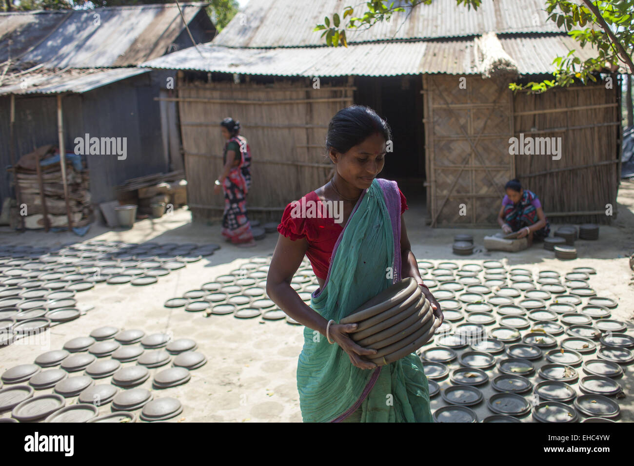 Dhaka, Bangladesh. 11th Mar, 2015.Potter making pots using clay near